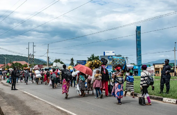 Rwandan soldiers accompany a group displaced people from DRC  Bugarama as they arrive in Rwanda