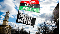 Black Lives Matter flags wave against the wind on Sunday, January 17, 2021
