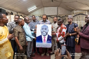 The group presented Dr. Matthew Opoku Prempeh with an artwork of his image and items