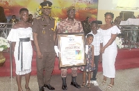 The Director-General of the GPS with Cpl Edward  Opoku