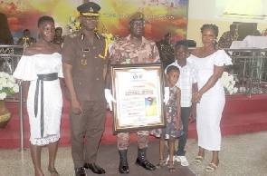 The Director-General of the GPS with Cpl Edward  Opoku