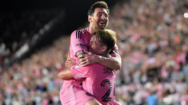 Messi celebrating a goal with his teammate