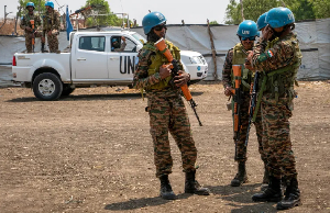 United Nations peacekeepers stand near an airstrip in Akobo, South Sudan, in February