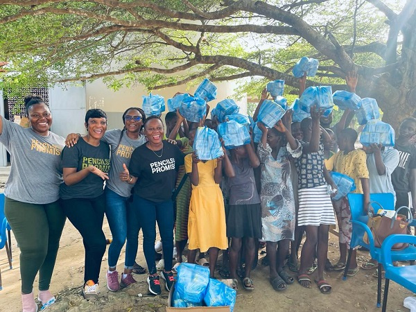 Children displaying the pads they received from PoP