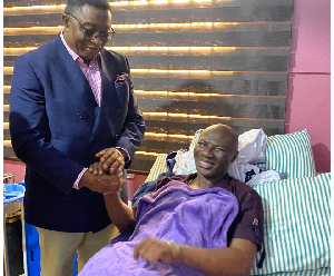 Elvis Afriyie-Ankrah shaking hands with Prophet Emmanuel Badu Kobi Elvis Afriyie-Ankrah shaking hands with Prophet Emmanuel Badu Kobi