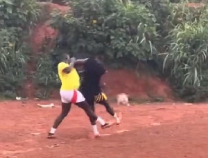 Onana in black, playing in a street game in Cameroon