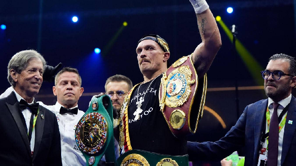 Oleksander Usyk (hand raised) has defeated Daniel Dubois for the second time