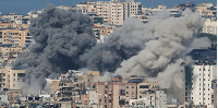 Smoke rises after an Israeli strike on Beirut's southern suburbs