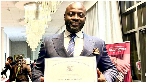 Dr. Michael K. Obeng with his letter signed by US president Joe Biden