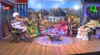 A wide shot of host MzGee (far left) with her guests
