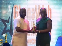 Georgina Fiagbenu receiving one of her two awards at the GhanaWeb Excellence Awards