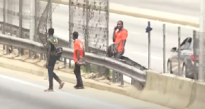 Some pedestrians crossing the road