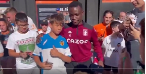 Owusu Amando in (tracksuit) taking pictures with the Valencia fans