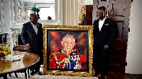 Ashenso (r) presenting the gift to President Akufo-Addo to be presented at the Buckingham Palace