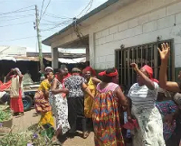Some of the traders prepare for the demonstration over the demolition of the market