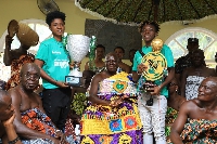 A photo of Ampem Darkoa Ladies FC presenting their trophies to Otumfuo Osei Tutu II