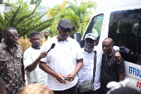 A picture of  Dr Nana Ayew Afriye speaking with his constituent