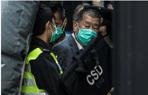 Media tycoon Jimmy Lai is escorted into a Hong Kong Correctional Services van outside the Court