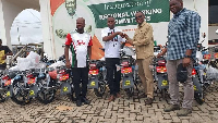 Fifi Kwetey (middle from right) presenting the motorbikes to some NDC executives