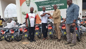 Fifi Kwetey (middle from right) presenting the motorbikes to some NDC executives