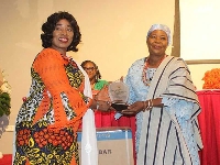 The minister presenting an award to a recipient
