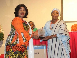 The minister presenting an award to a recipient