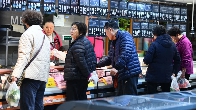 Customers at a supermarket in Fuyang City, East China's Anhui Province, Dec 9, 2023