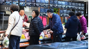 Customers at a supermarket in Fuyang City, East China's Anhui Province, Dec 9, 2023