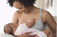 A mother breastfeeding a baby