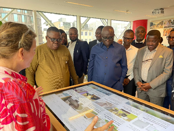 Eric Opoku (M) being given a talk about one of the local production plans