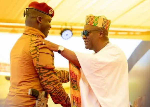 Captain Ibrahim Traoré (L) with John Dramani Mahama at the inauguration