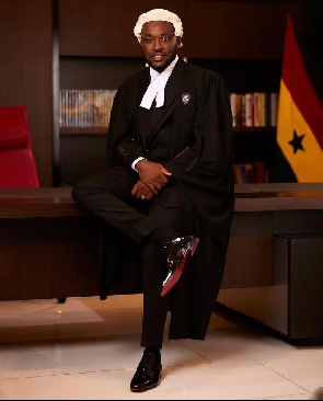 Kennedy Osei clothe in his peruke and dapper suit