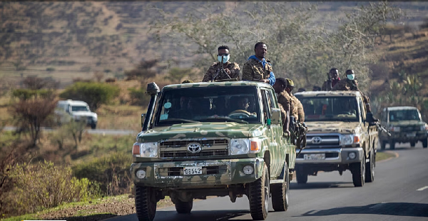 Ethiopian government soldiers travel in the back of trucks on a road near Agula, north of Mekele