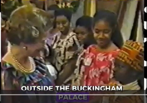 Queen Elizabeth when she met this Ghanaian boy dressed in kente