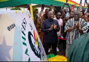 Minister for Lands and Natural Resources, Emmanuel Armah-Kofi Buah (L) is seen clapping