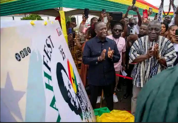 Minister for Lands and Natural Resources, Emmanuel Armah-Kofi Buah (L) is seen clapping