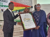 Nana Okoben receiving his award from the Western Regional Minister