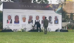 President John Mahama (in black) laying flower in honour of the 8 victims of helicopter crash