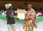 Osagyefo honored with a humanitarian award for service to Okurase