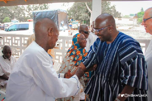 Fr Campbell and Dr Bawumia interacting cheerfully with some lepers on World Leprosy Day