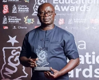 Osei Asibey Antwi with his award