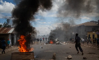 People protest in the streets of Arusha, Tanzania, on election day, on Wednesday, October 29, 2025