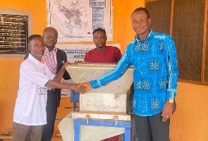 Amansie South DCE donating a gari processing machine and soap-making machine
