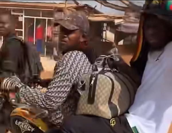 Andre Onana (in white) arrived in Cameroon via a motor bike