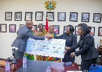 Justice Gertrude Torkornoo (2nd from R) presenting a cheque of GH¢125K to Samuel Okudzeto Ablakwa