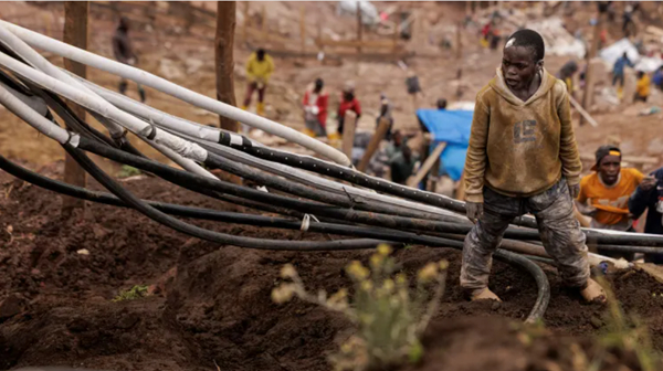 A young labourer arranges oxygen cables for installation in a new shaft at the Rubaya coltan mine
