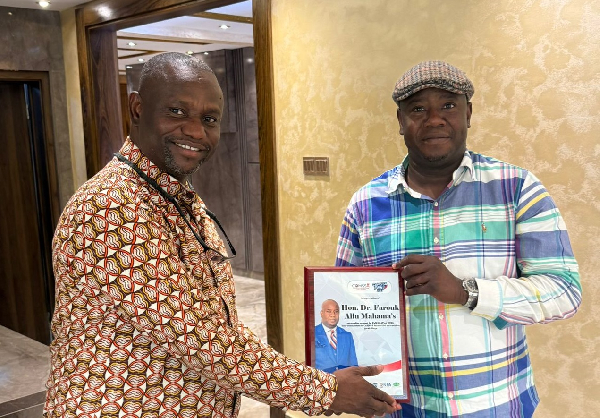 Dr Farouk Akiu Mahama (R) receiving the recognition