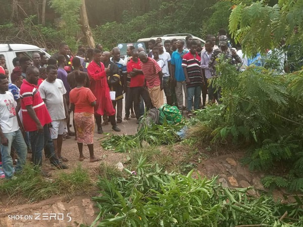 A group of people at the scene of an accident