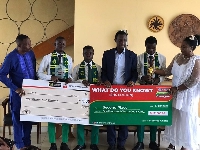 Kwabena Okyere Darko with the winners in a picture