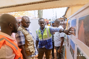 Asenso-Boakye being shown the project plan